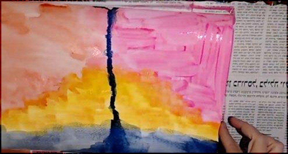 A watercolour background layer across a journal spread