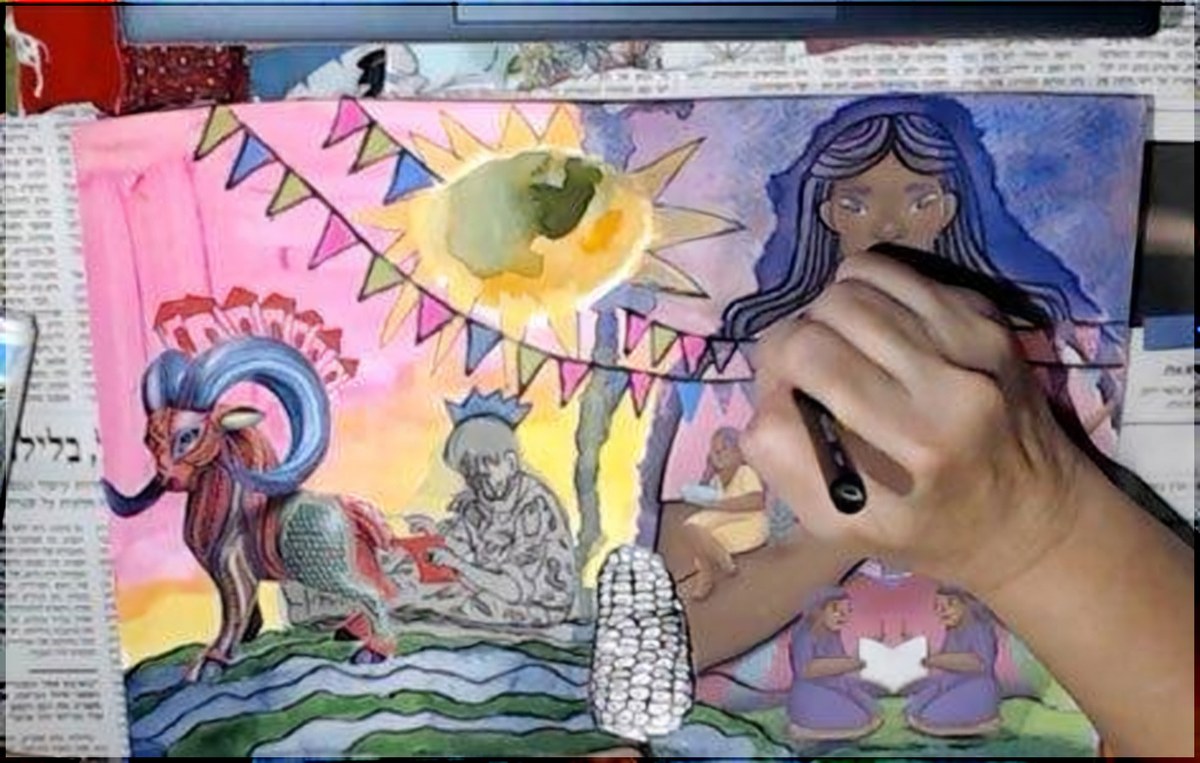 A hand drawing a black line across the spread