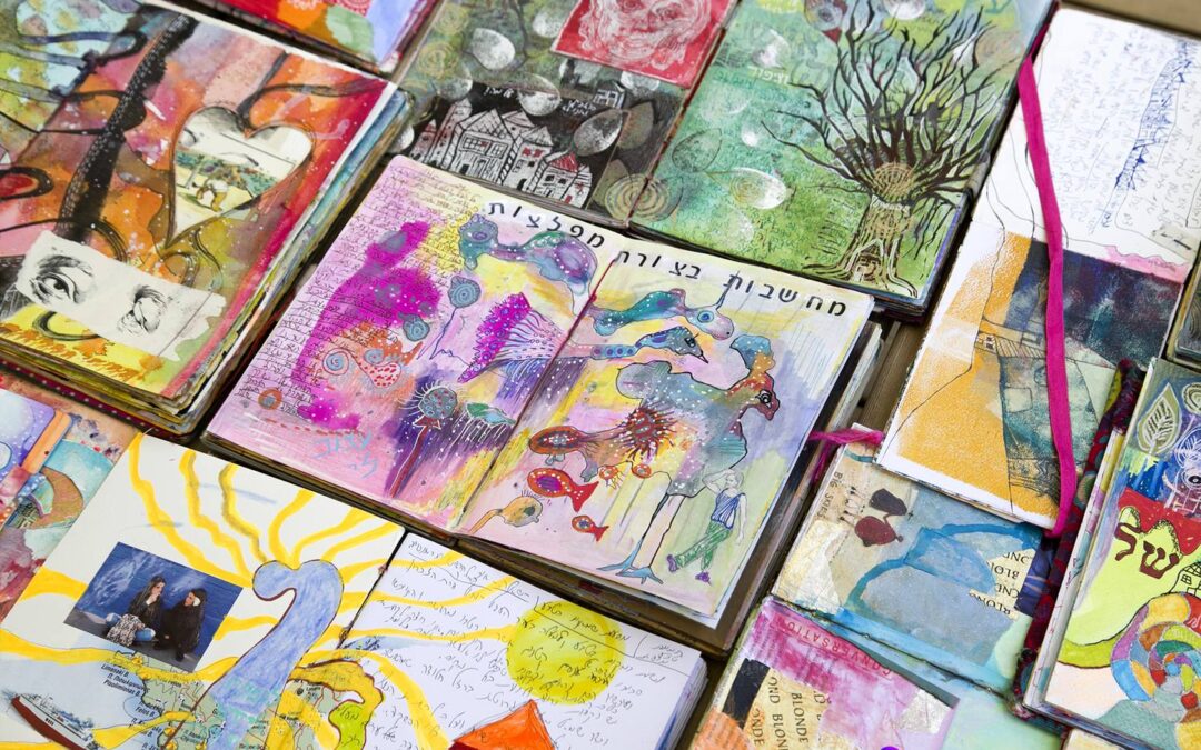 Dozens of SoulPages journals lying open on a table