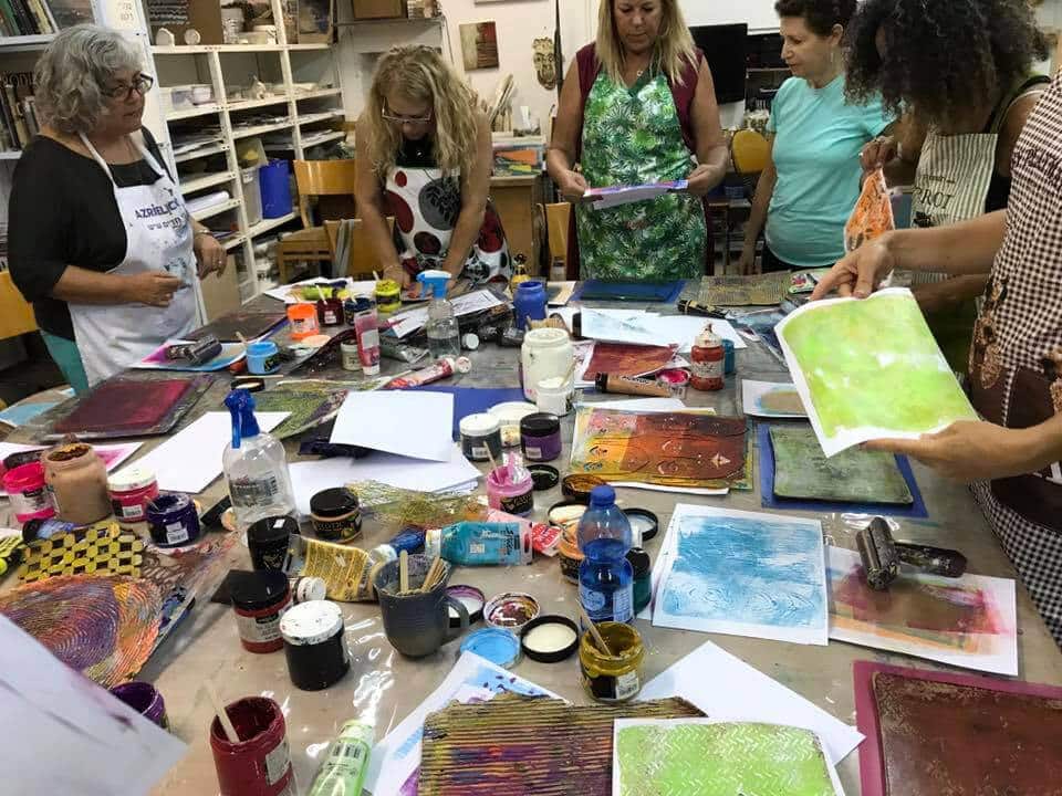 Women working together on their SoulPages journals